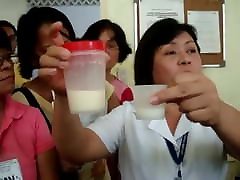 Filipina pumping tit milk for nurse