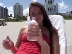 Tori lubnan vedio full is outdoors at the beach getting a tan