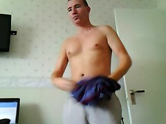 Male stripping in bedroom