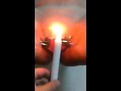 Women playing with candle inside pussy Women playing with candle inside pussy