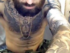 handsome muscled bearded hot tattoed guy showing off