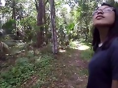Black man and Asian woman couple fucking outside in wilderness amateurs