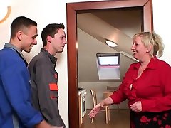 Two repairmen share very old blonde granny