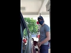 dude with a hot cock, exhibits himself while pumping gas.