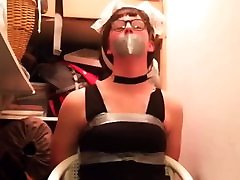 Naughty maid taped to a chair