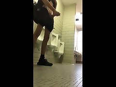 horny tall slim guy jerks off his big cock in the restroom