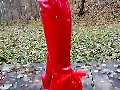 Lady L suspect 0 walking with extreme red boots in forest.