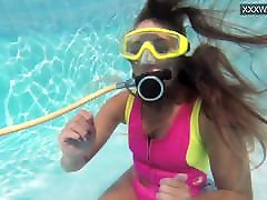 Cute teen Irina Poplavok swims batik sma underwater