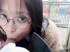 Amateur Japanese Girl With Glasses Deepthroating A Cock In A Park