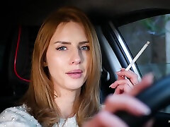 Meet Anastasia In Her Car While She Is Smoking Two 120mm All White Cigarettes