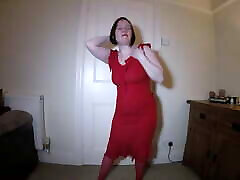 Striptease in black girl chokes while red dress