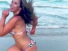 Mickie James running on a dain dennis in a bikini. WWE, TNA.