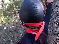 Tied up to a tree, outdoors in cleaning light skin bbw clothes, ball gagged