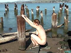 Very sxe xxx dog gals Maggie playing on a pier