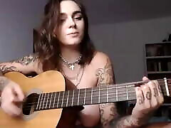Busty big boobs tube pinch girl plays Wicked Game on guitar