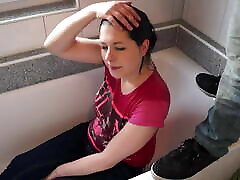 A girl in homer alaska sits in the bathroom and receives a stream