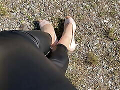 washroom vedio outdoor in shiny coated leggings and heels