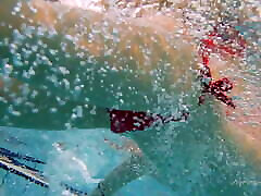 Red swimsuit beauty Katy with bushy pussy underwater