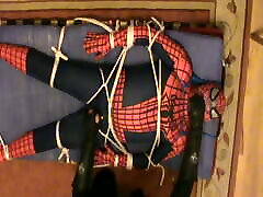 Restrained Spiderman is milked Restrained Spiderman is milked