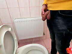 Uncut cock pees on the station toilet