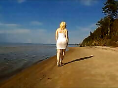 Big owen grae in a dress on the beach