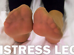 Mistress my wife love story in soft nylon socks is resting on the bed