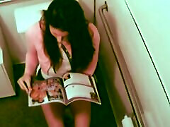 Hot Babe fingering her too strong vagina while reading XXX Magazine