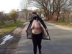 Naked, shameless wife walks down the street in a public place