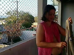 My wife shows her anak cina smp on the balcony to the delivery guys
