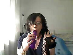 horny xxx lndain tranny simulates giving her partner a Blowjob on webcam while playing with a vibrator in her mouth
