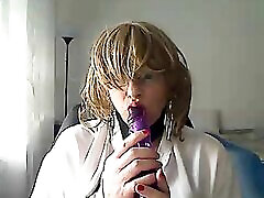 horny MILFhorny MILF tranny in front of webcam simulates a fuall xxx while playing with a vibrator in her mouth