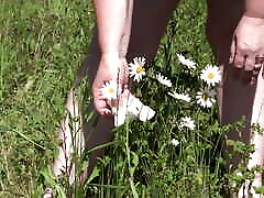 Piss on flowers in a public park. shierd love BBW with hairy pussy and fat ass watering flowers with her urine outdoors. ASMR