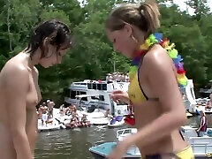 Lewd babes get undressed at a kinky bikini party on the lake