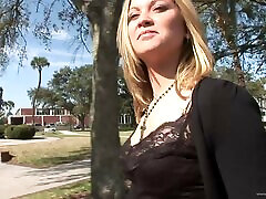 Slutty blonde chick flashes her natural tits in the street