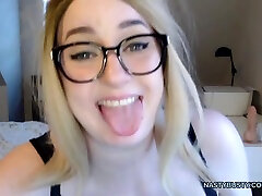 Nerd blonde shaking her huge boobs