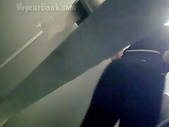 Voyeur in the next toilet room films white booty of a stranger girl