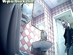 White chick in leather jacket and black pants pisses in the toilet room