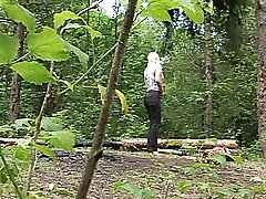 Adorable blonde babe in the forest sits on the fallen tree lily sex vidoe and pisses.