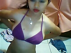 Beautiful Asian young webcam girl plays with her jugs