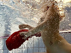 Redhead between hot milf teen mistress under water undressing on cam