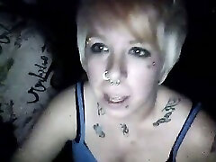 Short haired blonde skank in the dark room on webcam