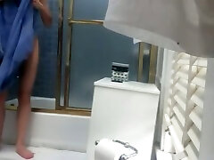 Spy camera catches slim teen chick moms watch xxx pron in a bathroom