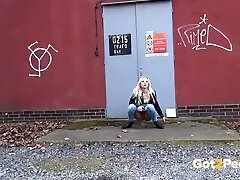 Squating down kinky amateur blonde pulls down jeans to pee outdoors