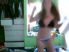This sexy teen is dancing seductively in front of the webcam