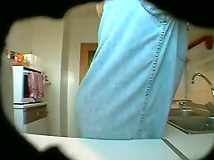 Fat and ugly matured wife changes her clothes in kitchen on spy cam