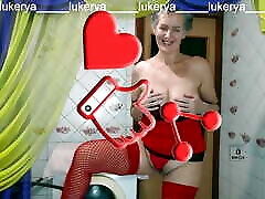 Hot housewife Lukerya in red amanda tae with her erotic fantasies in the kitchen in front of fans on the webcam online.