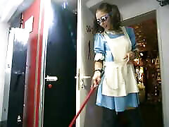 slave maid cleaning in latex suit the house