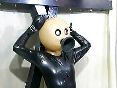 BDSM porno dog bizzarro latex suit with funnel head