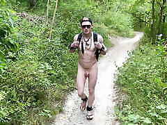 Slave in Chastity on a naked summer hike