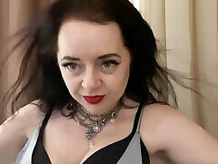 Horny and hot Mistress Lara plays with her boobs dressed in luxury outfit